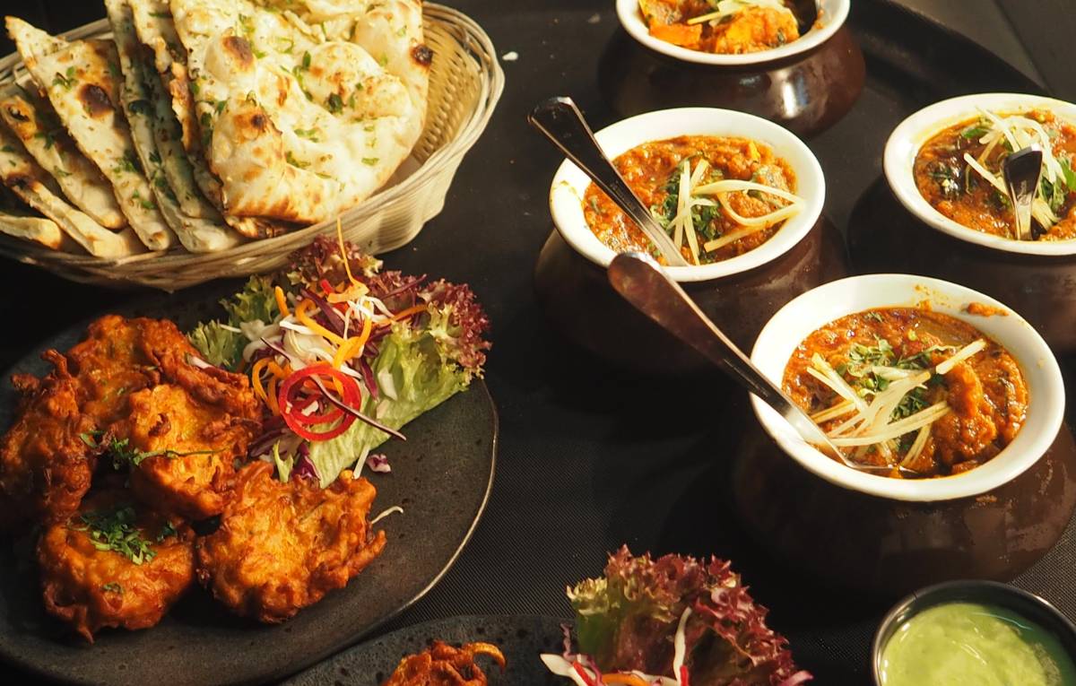 A table of curries and sides